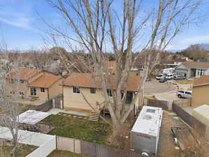 Fenced backyard with a residential view and stairway