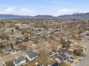 Aerial perspective of suburban area featuring a mountainous background