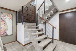 Staircase with ornamental molding and carpet