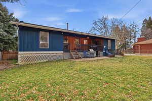 Back of property with a patio and a deck