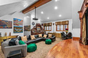 Living area featuring wood finished floors and bar area
