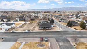 Aerial perspective of suburban area featuring a mountainous background
