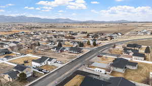 View of property location featuring nearby suburban area and a mountainous background