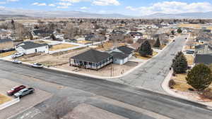 Aerial perspective of suburban area featuring a mountainous background