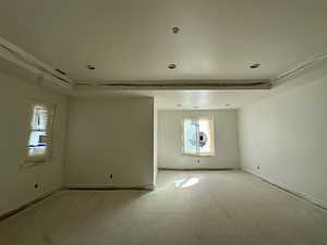 Primary bedroom featurnig raised ceiling