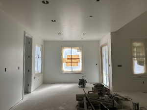 Kitchen facing dining nook next to family room