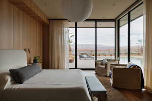 Cozy Primary Bedroom with Incredible Views, Gas Fireplace, Large Slider Leading to the Back Patio, and Speakers