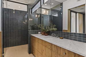 Ensuite Bathroom 2 with Speakers and Marble Countertops