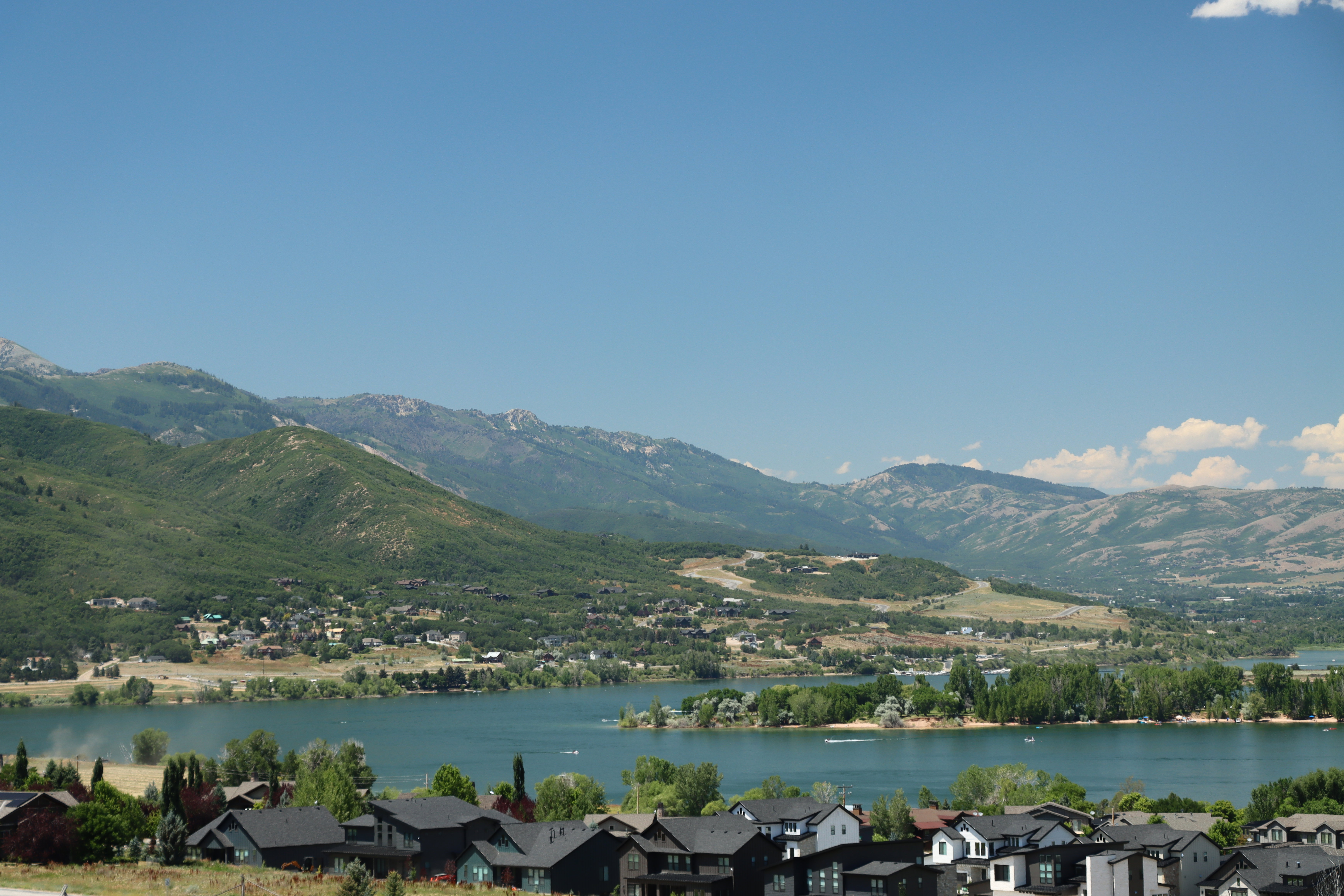 Water view with mountains and nearby suburban area