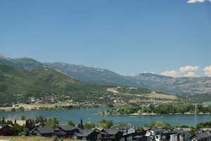 Water view with mountains and nearby suburban area