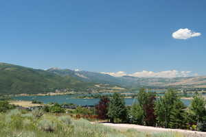 View of mountain backdrop with a nearby body of water