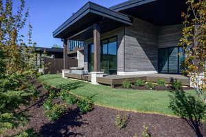 Rear view of house with a wooden deck