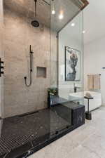 Full bath featuring a stall shower, a freestanding tub, recessed lighting, and tile patterned floors