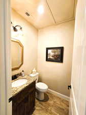 Bathroom featuring vanity and toilet