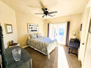Bedroom featuring french doors, access to exterior, light colored carpet, and ceiling fan