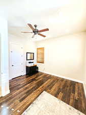 Unfurnished living room featuring dark wood-style flooring, a ceiling fan, and recessed lighting