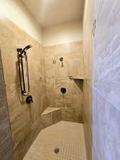 Full bathroom with tiled shower