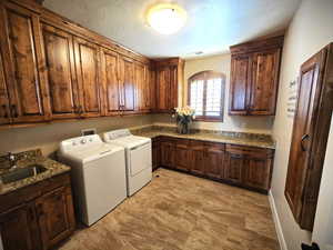 Laundry room with cabinet space and washer and dryer