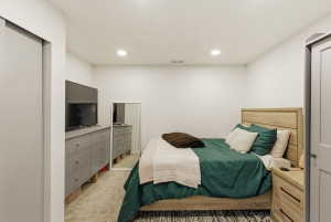 Carpeted bedroom featuring recessed lighting