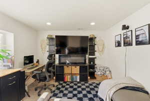 Office space with carpet floors and recessed lighting