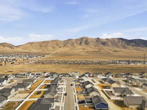 Aerial perspective of suburban area featuring a mountain backdrop