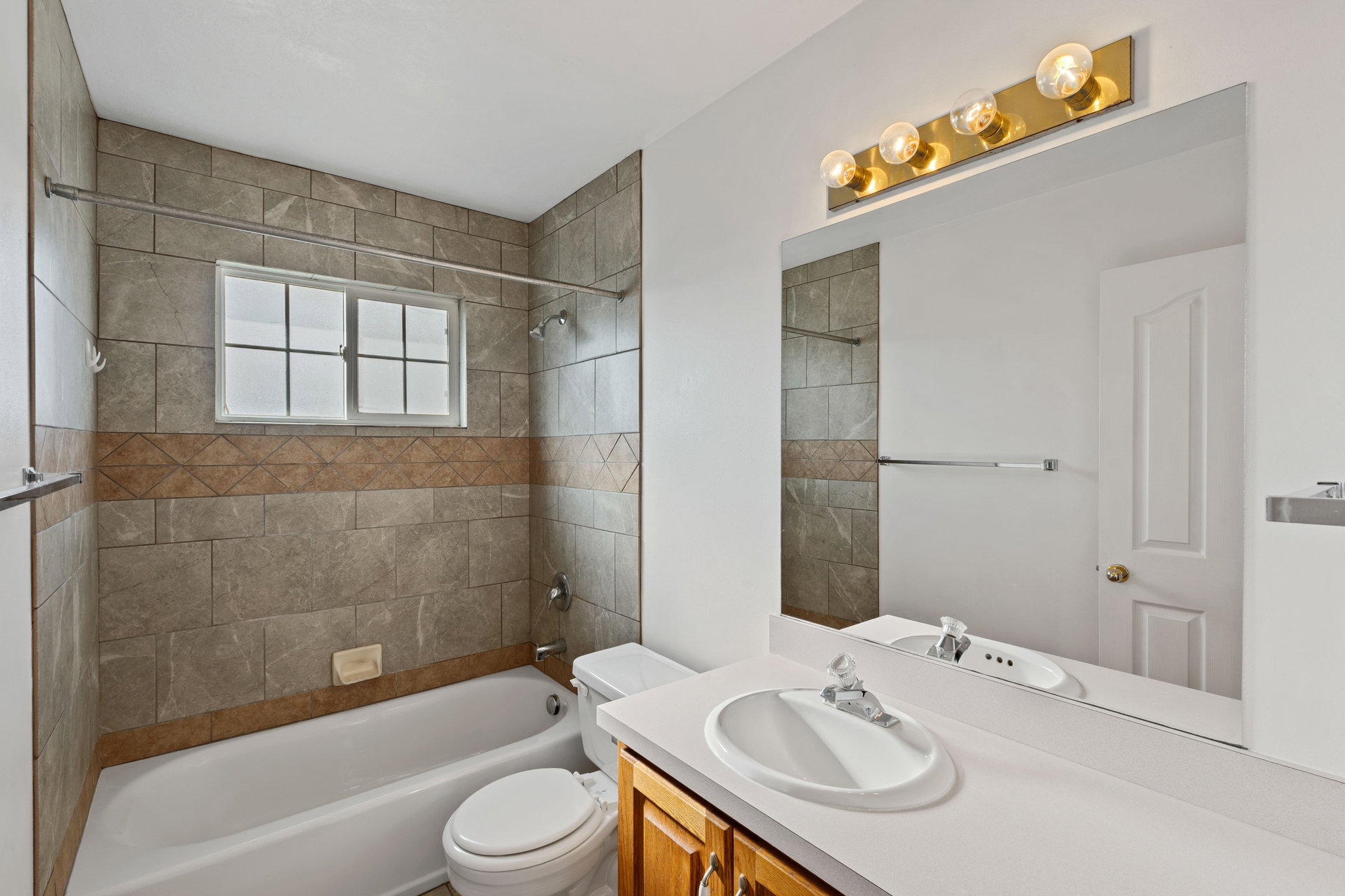 Full bathroom featuring vanity and  shower combination