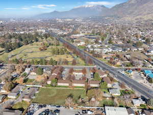 Aerial overview of property's location with mountains and nearby suburban area