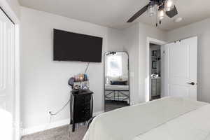 Bedroom with carpet flooring, a closet, and ceiling fan