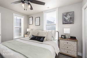 Carpeted bedroom with ceiling fan