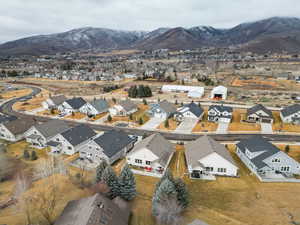 Aerial overview of property's location with mountains and nearby suburban area