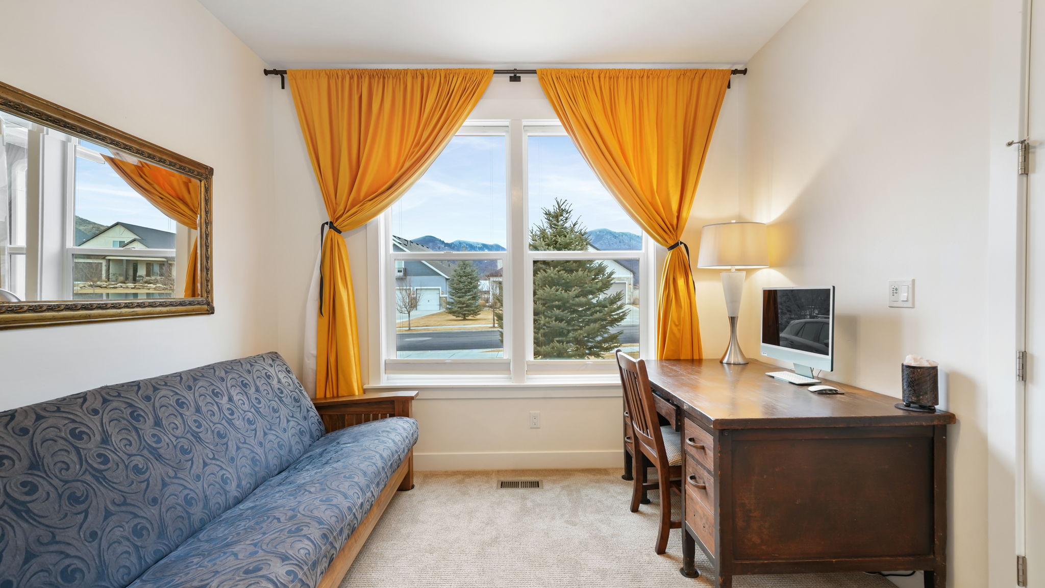 Bright interior space featuring a double window, light-toned walls, and soft carpeting