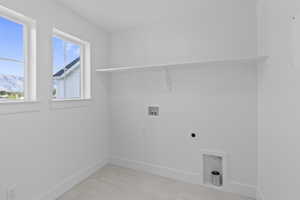 Laundry room featuring washer hookup and hookup for an electric dryer