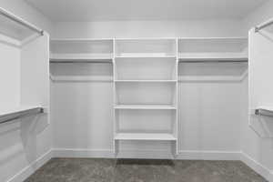 Walk in closet featuring carpet