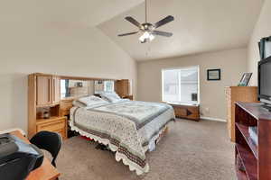 Primary Bedroom with vaulted ceiling, and ceiling fan