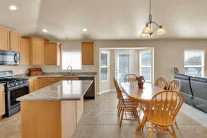 Kitchen with stainless steel appliances,  granite  counters, a center island