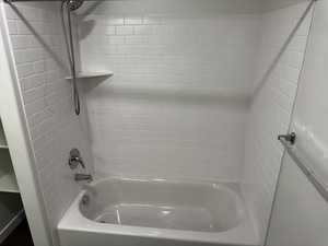 Full bathroom with shower / bathtub combination