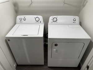 Laundry area featuring washing machine and clothes dryer