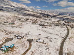 View of mountain backdrop featuring nearby suburban area