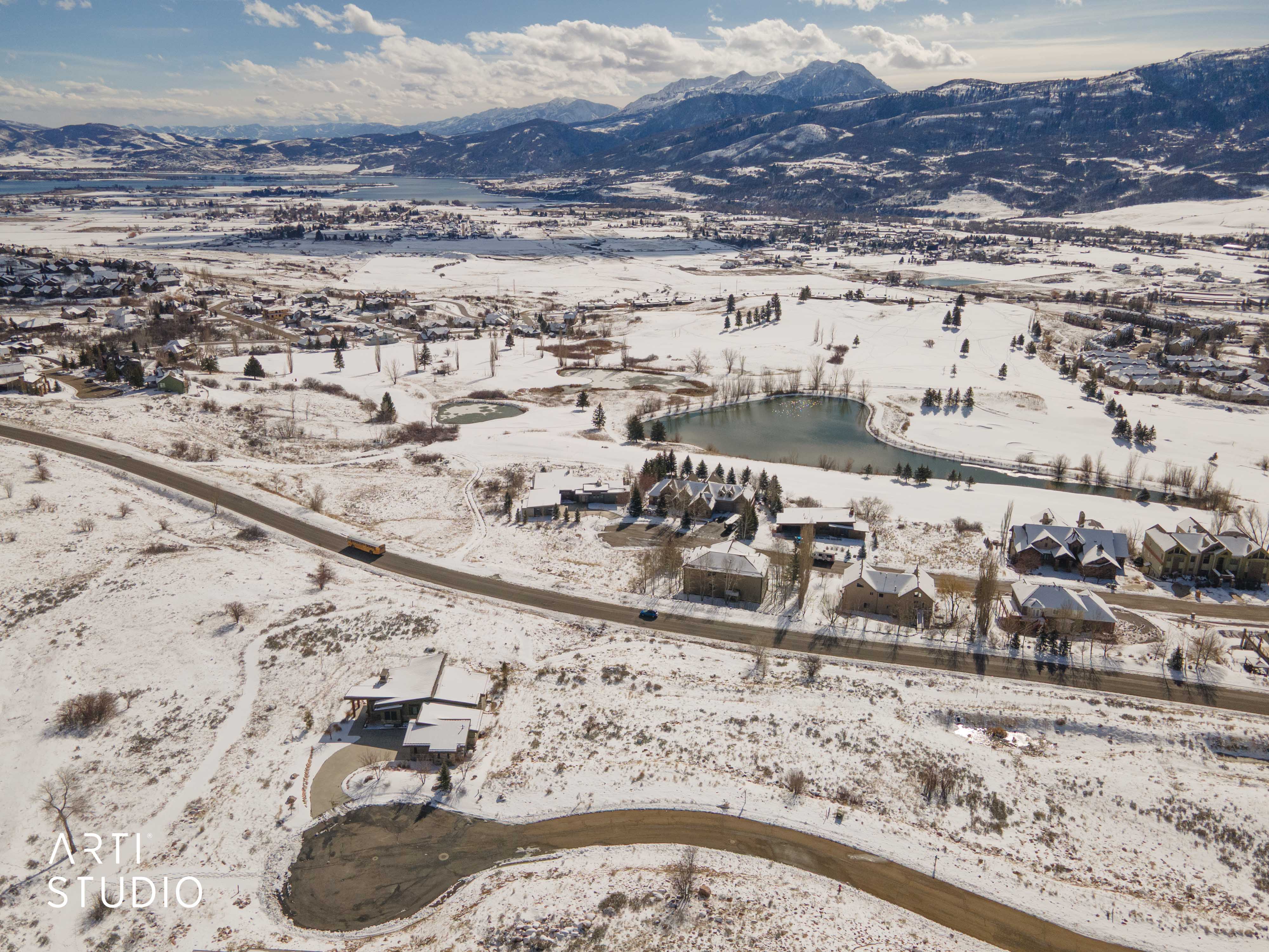 Snowy aerial view with a mountain view