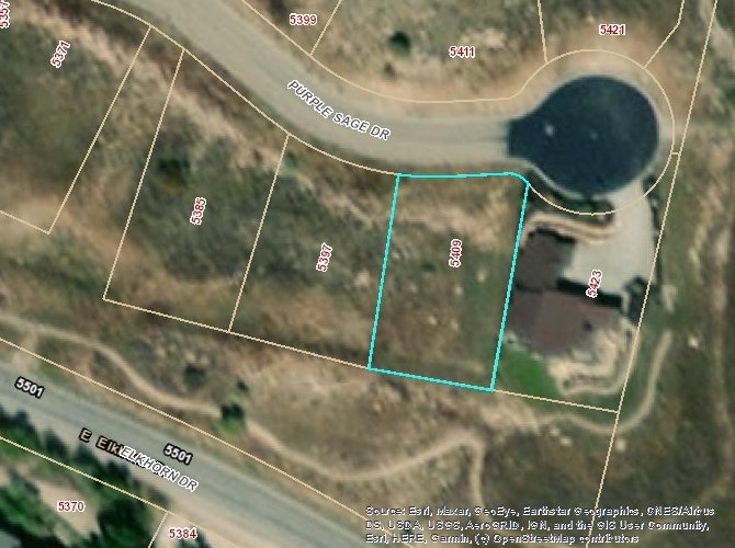 Aerial map of property and surrounding area featuring property boundaries highlighted