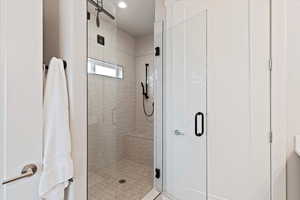 Bathroom featuring a shower stall