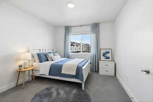Carpeted bedroom with baseboards
