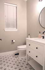 Bathroom with baseboards and vanity