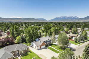 Aerial view of residential area featuring a mountainous background