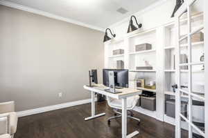 Home office featuring crown molding and dark wood finished floors
