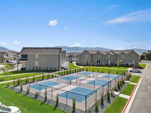 View of swimming pool featuring a residential view, a tennis court, and a mountain view