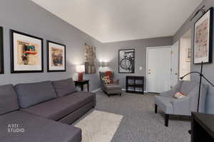 Living room featuring carpet floors and baseboards
