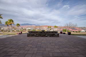 View of patio with a residential view and a mountain view