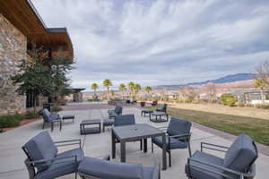 View of patio with a mountain view and an outdoor lounge area