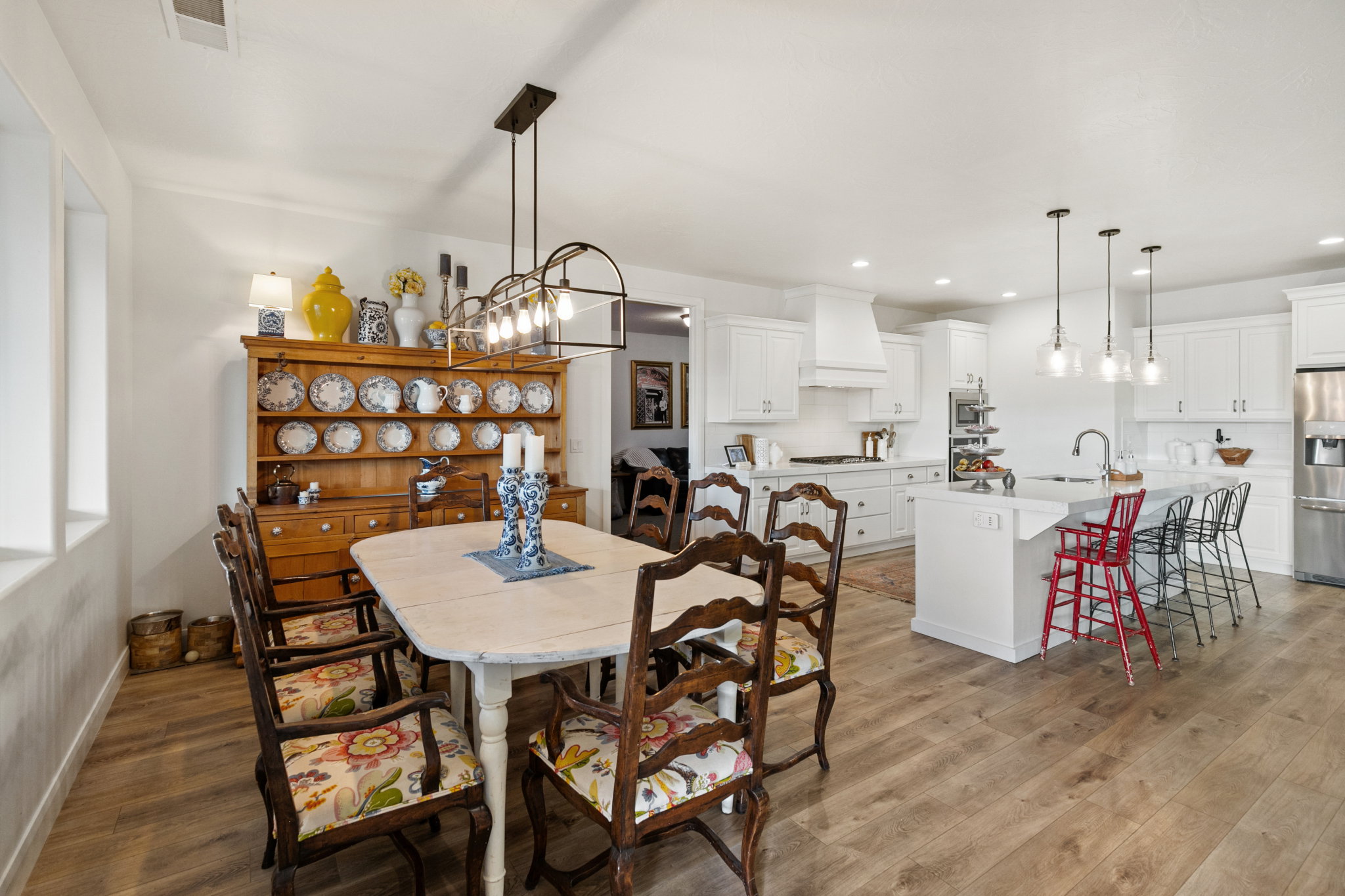 Dining area featuring light wood finished floors and suspended lighting